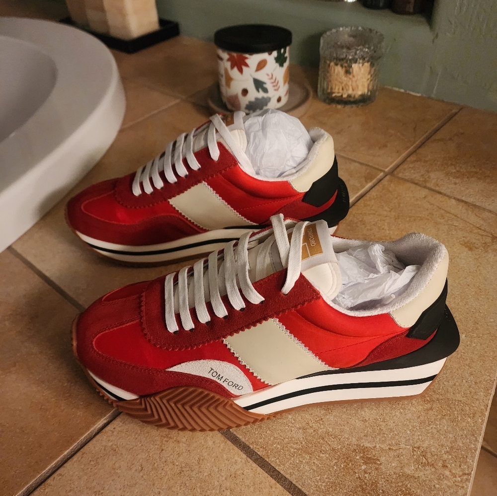 Red and white shoes with TF on it